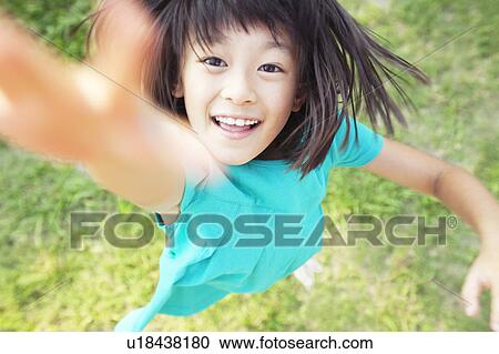 Young Girl Jumping and Reaching for Camera View Large Photo Image Stock Image - Young Girl Jumping and Reaching for Camera. Fotosearch