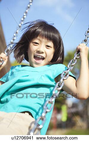 Young Girl on Swing View Large Photo Image Stock Image - Young Girl on Swing. Fotosearch