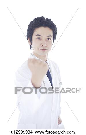 Young Male Doctor with Fist Raised View Large Photo Image Picture - Young Male Doctor with Fist Raised. Fotosearch