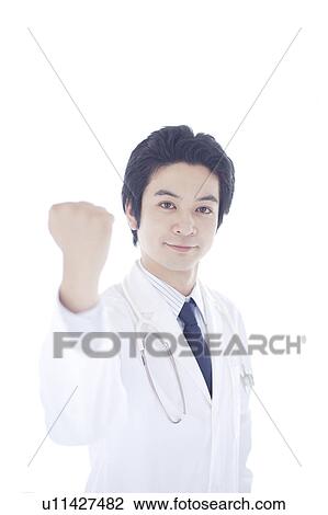 Young Male Doctor with Fist Raised View Large Photo Image Stock Image - Young Male Doctor with Fist Raised. Fotosearch