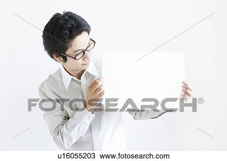 Stock Image - Young Man Holding Blank Message. Fotosearch