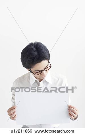 Stock Photograph - Young Man Holding Blank Message. Fotosearch