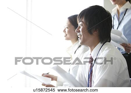 Stock Photography - Young Man in Meeting. Fotosearch