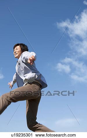 Young Man Jumping Mid Air View Large Photo Image Stock Image - Young Man Jumping Mid Air. Fotosearch