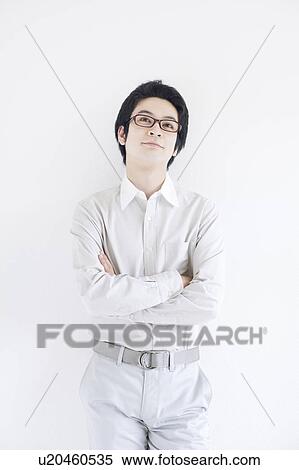 Stock Photography - Young Man Thinking. Fotosearch