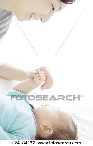 Young Mother with Newboarn Baby View Large Photo Image Stock Image - Young Mother with Newboarn Baby. Fotosearch