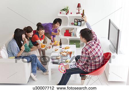 Stock Image - Young people chatting. Fotosearch