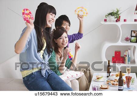 Young people watching TV View Large Photo Image Stock Image - Young people watching TV. Fotosearch