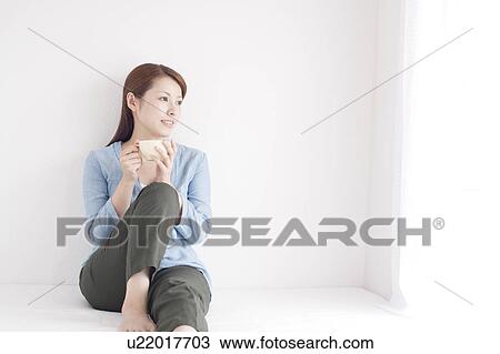 Young Woman Having Cup of Tea View Large Photo Image Stock Image - Young Woman Having Cup of Tea. Fotosearch