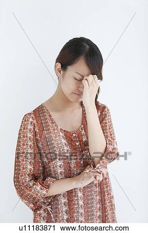 Stock Image - Young Woman in Pain. Fotosearch