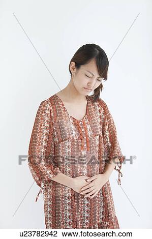 Stock Image - Young Woman in Pain. Fotosearch