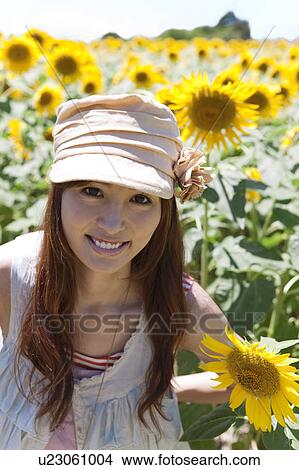 Young Woman in Sunflower Field View Large Photo Image Picture - Young Woman in Sunflower Field. Fotosearch