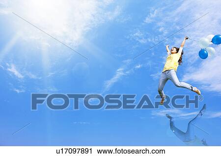 Stock Image - Young Woman Jumping. Fotosearch