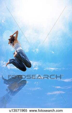 Stock Photography - Young Woman Jumping. Fotosearch