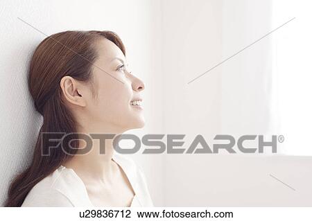 Young Woman Leaning Against Wall View Large Photo Image Stock Image - Young Woman Leaning Against Wall. Fotosearch