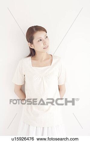 Young Woman Leaning Against Wall View Large Photo Image Stock Photograph - Young Woman Leaning Against Wall. Fotosearch