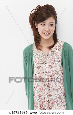 Stock Photography - Young woman looking away. Fotosearch