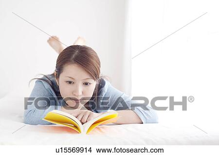 Picture - Young Woman Reading Book. Fotosearch