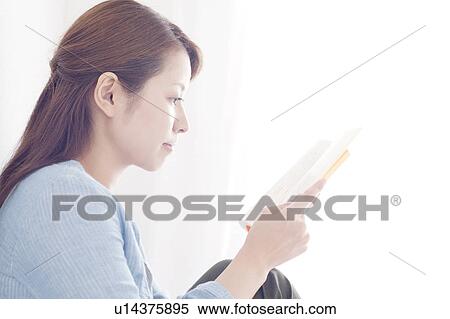Stock Photography - Young Woman Reading Book. Fotosearch