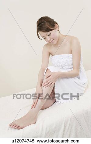 Young Woman Sitting on Massage Table View Large Photo Image Stock Photography - Young Woman Sitting on Massage Table. Fotosearch