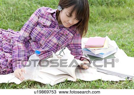 Young Woman Studying Outdoors View Large Photo Image Stock Image - Young Woman Studying Outdoors. Fotosearch