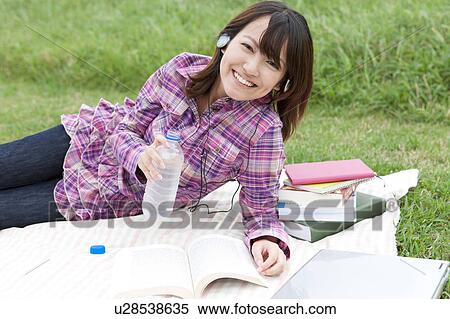 Young Woman Studying Outdoors View Large Photo Image Stock Photography - Young Woman Studying Outdoors. Fotosearch