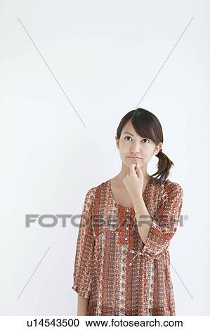 Stock Image - Young Woman Thinking. Fotosearch