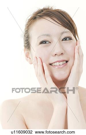 Young Woman Touching Her Face View Large Photo Image Stock Image - Young Woman Touching Her Face. Fotosearch