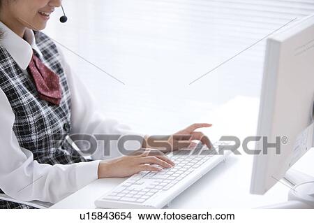 Young Woman Typing View Large Photo Image Picture - Young Woman Typing. Fotosearch