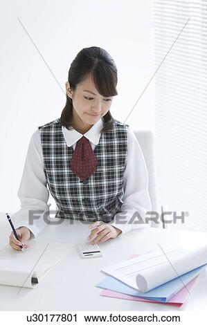 Young Woman Using Calculator View Large Photo Image Stock Image - Young Woman Using Calculator. Fotosearch