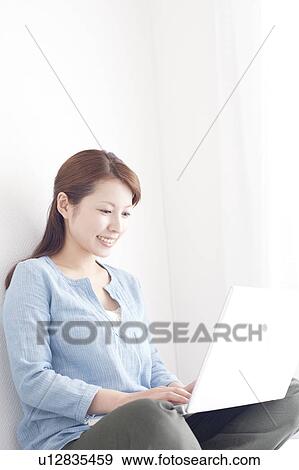 Young Woman Using Laptop View Large Photo Image Stock Photo - Young Woman Using Laptop. Fotosearch
