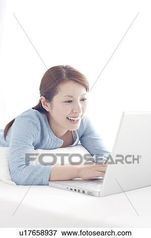 Young Woman Using Laptop View Large Photo Image Stock Photo - Young Woman Using Laptop. Fotosearch