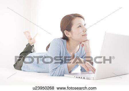 Young Woman Using Laptop View Large Photo Image Stock Photo - Young Woman Using Laptop. Fotosearch