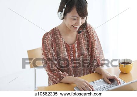 Stock Photography - Young Woman Using Laptop. Fotosearch