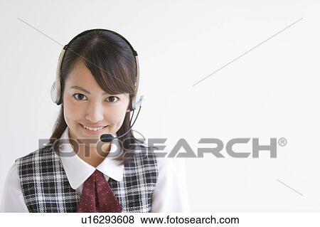 Stock Photo - Young Woman Wearing Headset. Fotosearch