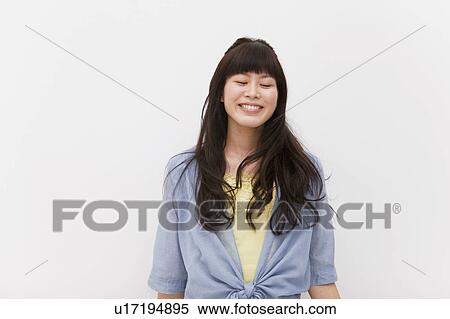 Young woman with eyes closed View Large Photo Image Stock Photography - Young woman with eyes closed. Fotosearch