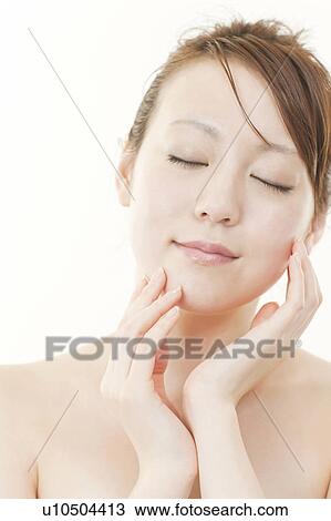 Young Woman with Eyes Closed Touching Her Face View Large Photo Image Stock Image - Young Woman with Eyes Closed Touching Her Face. Fotosearch