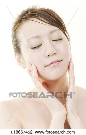 Young Woman with Eyes Closed Touching Her Face View Large Photo Image Stock Image - Young Woman with Eyes Closed Touching Her Face. Fotosearch