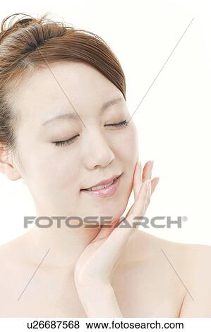 Young Woman with Eyes Closed Touching Her Face View Large Photo Image Stock Photo - Young Woman with Eyes Closed Touching Her Face. Fotosearch