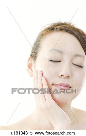 Young Woman with Eyes Closed Touching Her Face View Large Photo Image Stock Photography - Young Woman with Eyes Closed Touching Her Face. Fotosearch