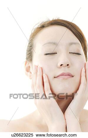 Young Woman with Eyes Closed Touching Her Face View Large Photo Image Stock Photography - Young Woman with Eyes Closed Touching Her Face. Fotosearch