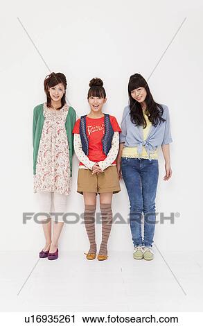 Young women smiling View Large Photo Image Stock Image - Young women smiling. Fotosearch