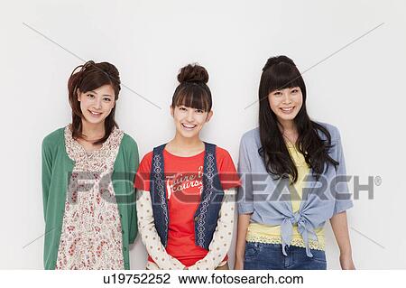 Young women smiling View Large Photo Image Stock Image - Young women smiling. Fotosearch