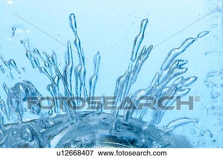 Stock Photo - Air Bubbles in Frozen Water. Fotosearch