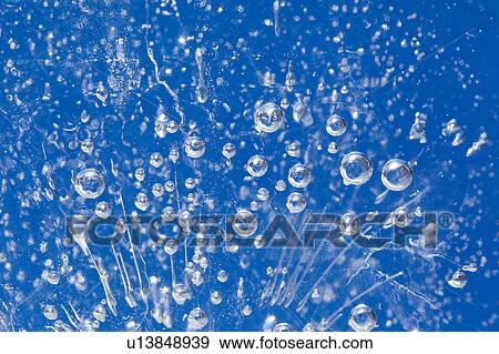 Stock Photo - Air Bubbles in Frozen Water. Fotosearch