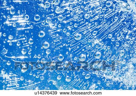 Stock Photo - Air Bubbles in Frozen Water. Fotosearch