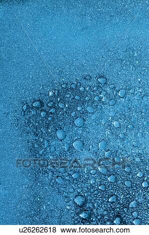 Stock Photo - Air Bubbles in Frozen Water. Fotosearch
