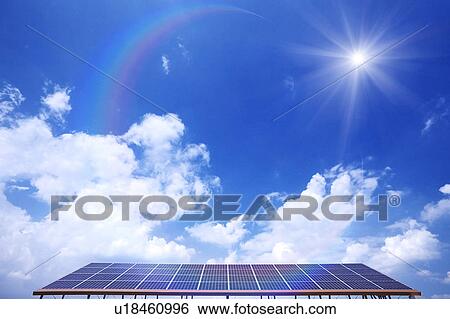 Stock Photograph - Blue Sky and Sun Over Solar Panels. Fotosearch