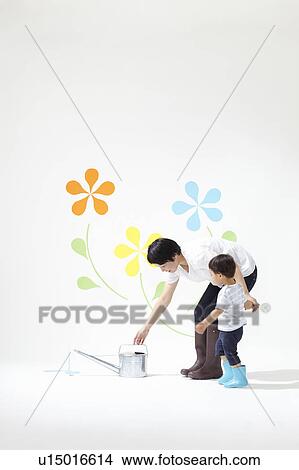 Boy and Mother Watering Plants View Large Photo Image Picture - Boy and Mother Watering Plants. Fotosearch