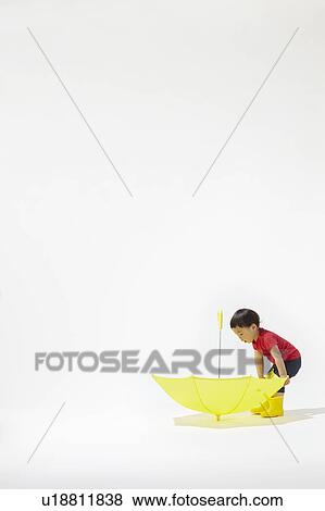Boy and Yellow Umbrella View Large Photo Image Stock Photo - Boy and Yellow Umbrella. Fotosearch
